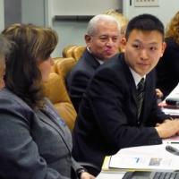 Ming Hwee Chong, pictured center, representative of the Baha'i International Community to the United Nations, addresses a panel discussion held at the UN as part of this year's session of the Commission for Social Development. Pictured far left is Jomo Kwame Sundaram, UN Assistant Secretary General for Economic Development.