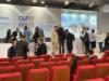 Speakers and attendees conversing after the event