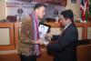 Presentation of token of appreciation by Mr. Hassan, Rector of UNIRA