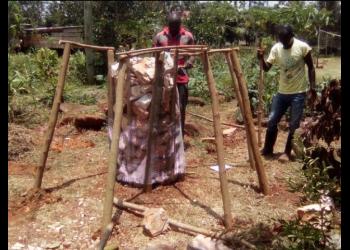 Construction of a “food tower” at the training center of the Kimanya-Ngeyo Foundation for Science and Education, a Baha’i-inspired organization in Uganda.