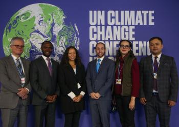 Baha’is attending COP 26, including the Baha’i International Community’s delegation; from left, Halldor Thorgeirsson, Peter Aburi, Naima Te Maile, Daniel Perell, Maja Groff, Serik Tokbolat. Photo by Kiara Worth