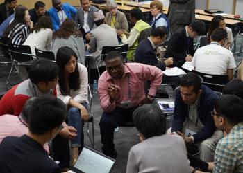 Participants consult on the qualities of a holistic education at the Baha'i International Community’s workshop on 31 May, 2016 entitled “Community Driven Education: Local Ownership for Global Advancement.”