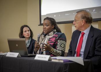A delegate of the Baha'i International Community presents on a panel during the Commission on the Status of Women 